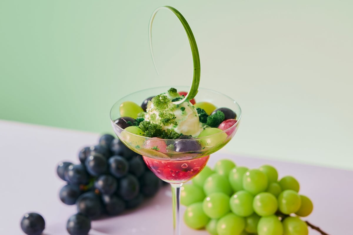 A parfait with shimmering jelly, cool ice cream, and refreshing granita for a delightful chill.