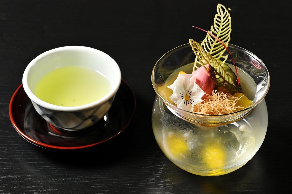 Matcha and mango mousse with red shiso and raspberry sherbet arranged like an ikebana parfait
