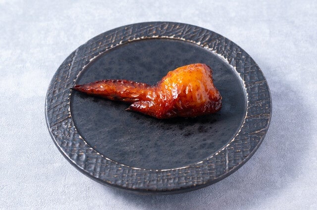 Grilled chicken wings wrapped with foie gras