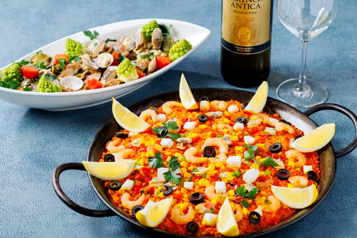 Seafood paella (front), white fish aquapazza (back)