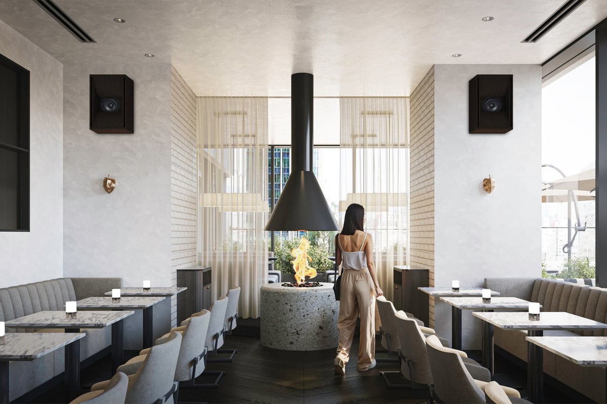 Enjoy a refreshing time during lunch in a bright and open atmosphere with high ceilings and sunlight pouring through large windows.