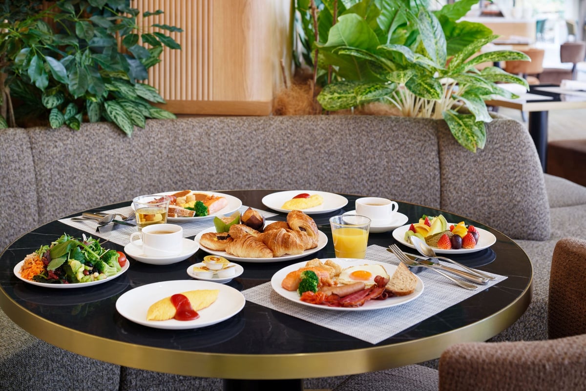 A breakfast buffet with a variety of Japanese and Western dishes.