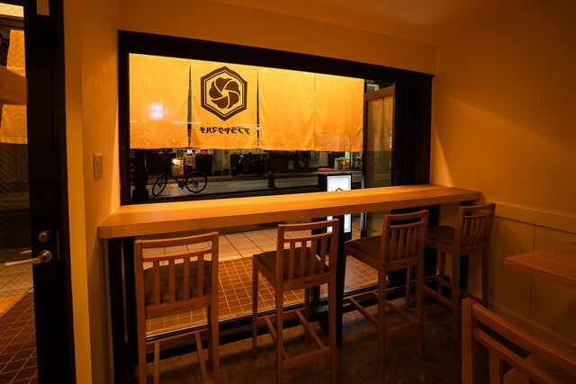 Counter seats facing the street with a view