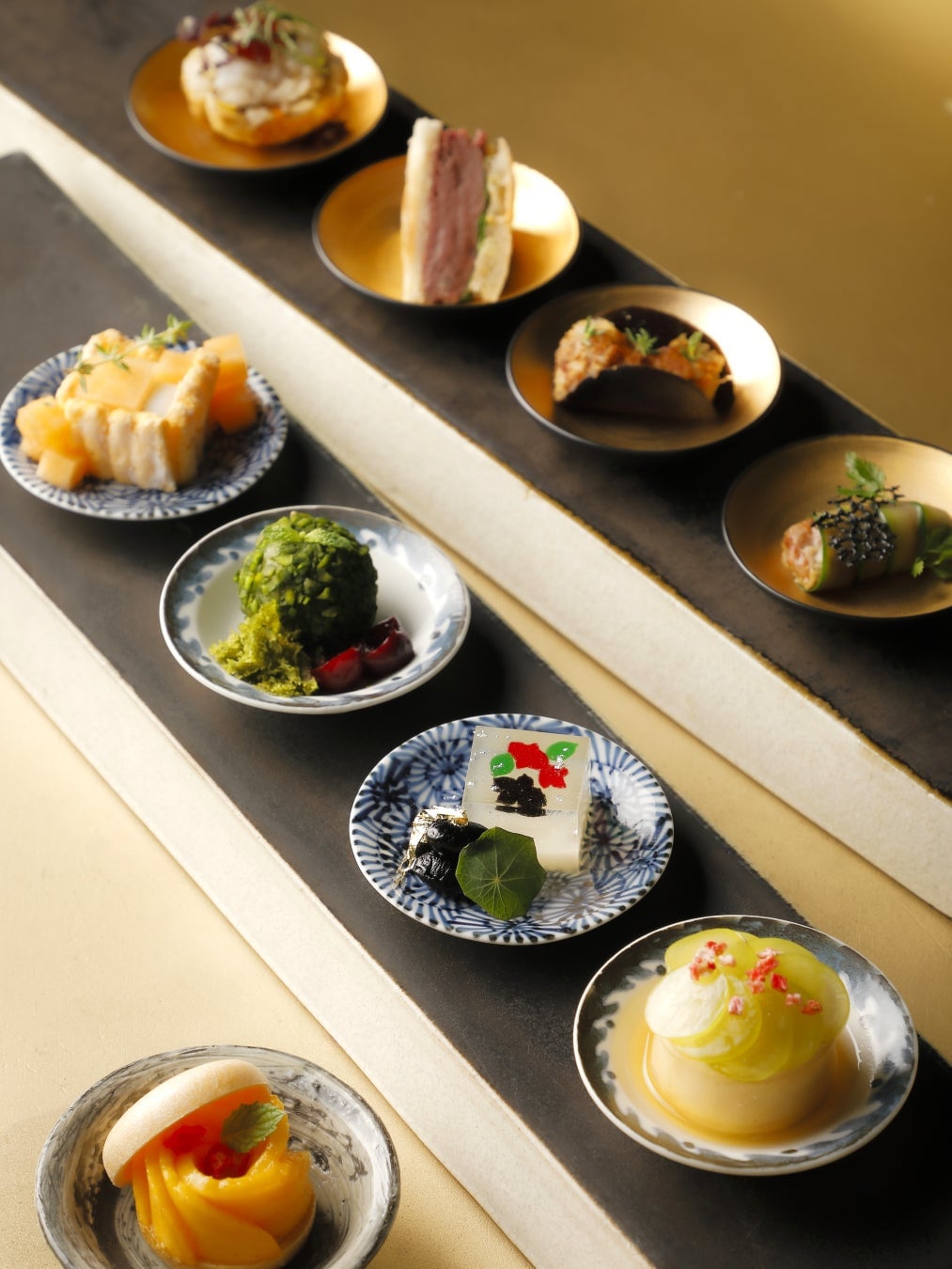 A selection of savory dishes reflecting Kyoto's summer, alongside sweets inspired by forest gardens and cool breezes.
