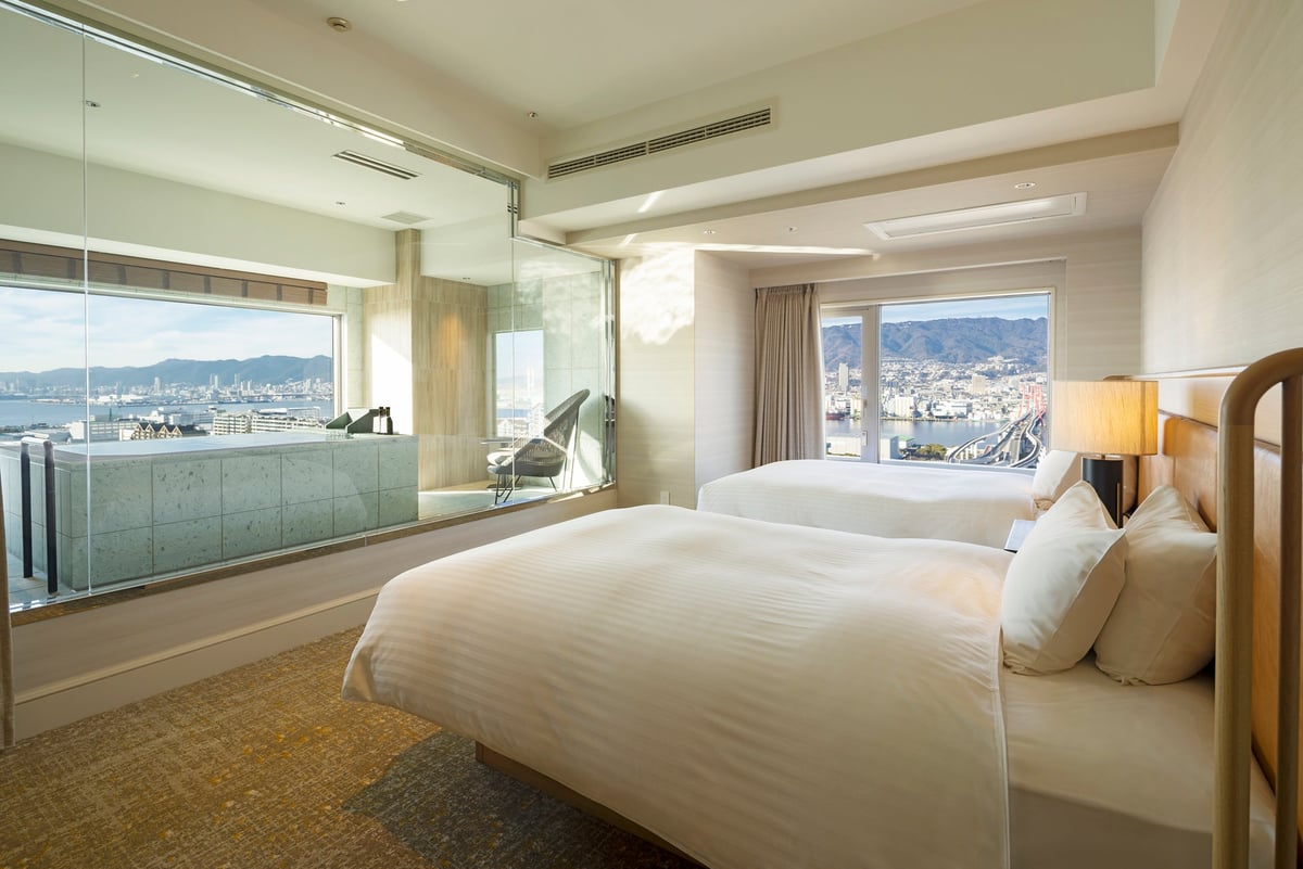 A new Club Floor Corner View Bath Twin room, completed in December 2025, offering a panoramic view of the port city Kobe