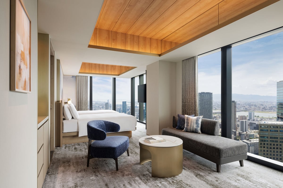A corner room overlooking the sparkling fireworks and autumn sky alongside the dynamic Osaka cityscape.