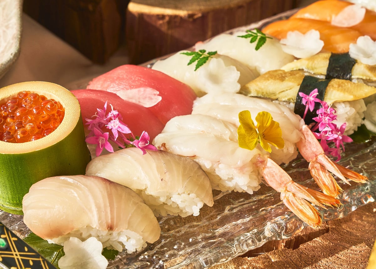 At the Japanese sushi counter, selected toppings are hand-rolled in front of you.