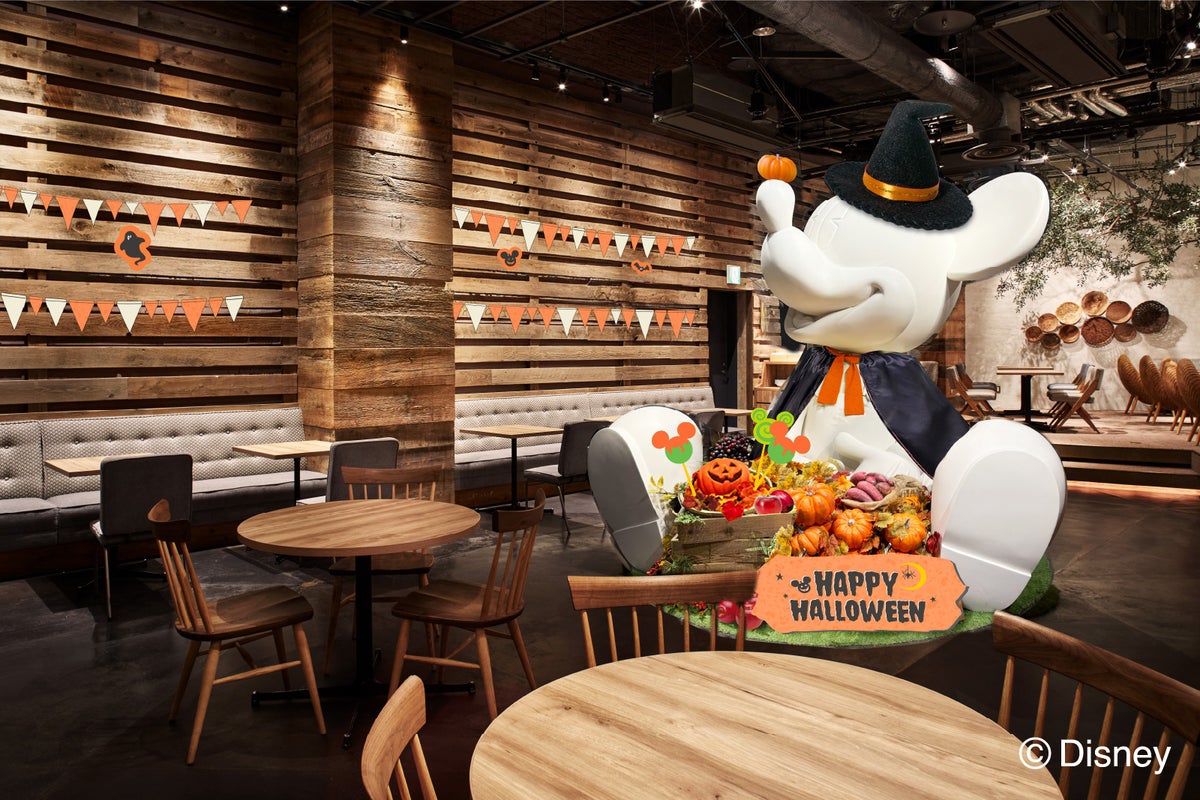 The Mickey Mouse-themed statue inside is also decorated with Halloween design.