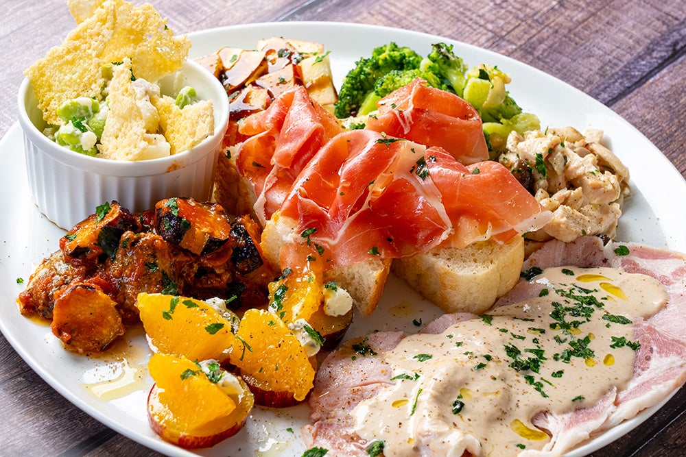 The photo shows a platter for four. Contents are subject to change.