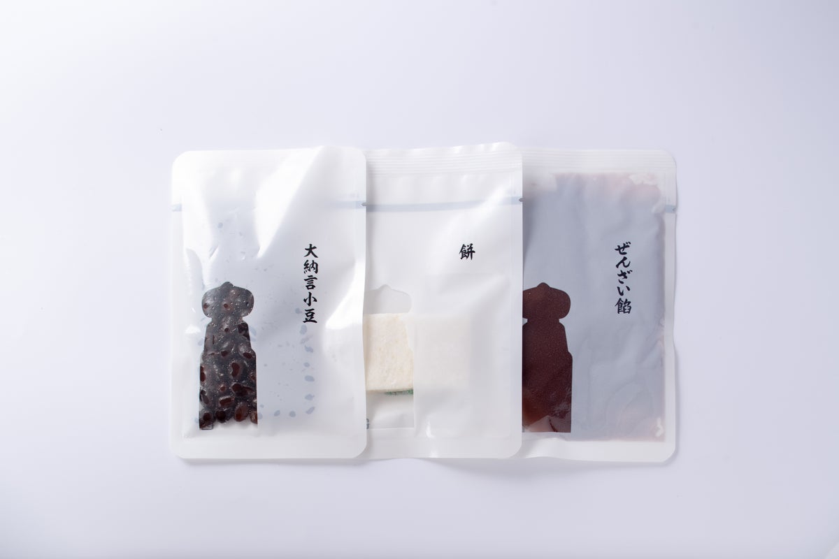 Each component, including large adzuki beans, mochi, and zenzai filling, is individually wrapped and set