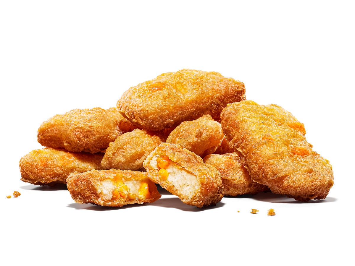 Product: Cheese Chicken Nuggets — Available from October 2, 2026 (Friday) — ¥330 (tax included) for 5 pieces, ¥480 (tax included) for 8 pieces, ¥810 (tax included) for 16 pieces. Comes with a choice of BBQ or mustard sauce. 5 and 8-piece options include one sauce, while the 16-piece includes two sauces.