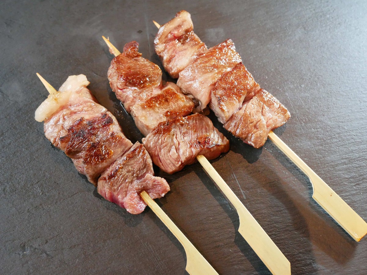 Sankyo Livestock's Aka Buta pork belly skewer and Akaushi beef skewer