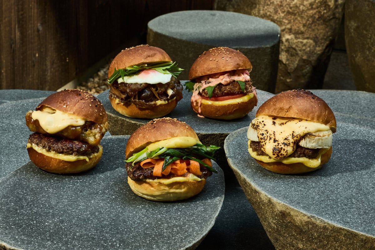 Right to left: Kyo Kabu Gratin Burger, Kyoto Vegetable Miso Teriyaki Burger, Sansho Beef Sukiyaki Burger, Maitake Tempura Junky Cheese Burger, Sansho Beef Sukiyaki Burger, Fish Fry Shibazuke Tartar Burger