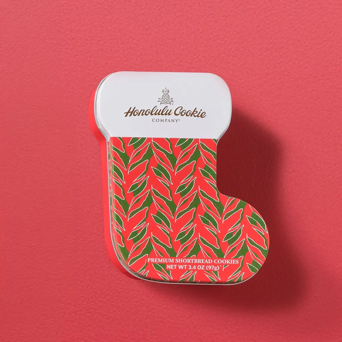 Mele Stocking Gift Can with 5 varieties and 6 pieces — a sweet surprise from Hawaii in a Christmas stocking-shaped can. Filled with seasonal and popular shortbread cookies, this unique packaging evokes Christmas cheer with a Hawaiian-inspired design.