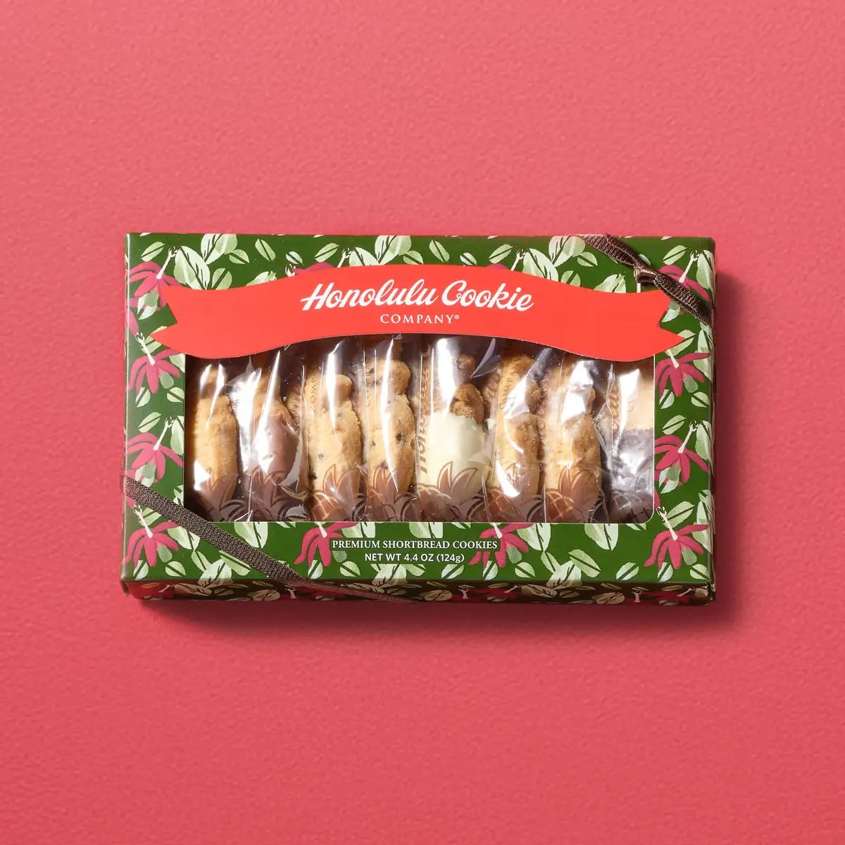 Mele Window Box with 6 varieties and 8 pieces — a Hawaiian holiday gift that excites from the moment you see it. Decorated with Hawaiian-inspired artwork and colorful cookies visible through the windows. Includes flavors like Toffee Macadamia and White Chocolate Ginger Spice, perfect for Christmas.