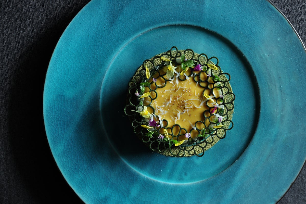 A new signature dish blending Okinawan food culture with Italian culinary techniques: Goya Champuru.